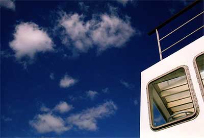Deep blue sky and white ferry boat
